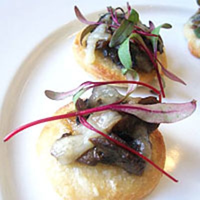 Everybody Eats Inc.'s gluten-free mini pizzettes with wild mushrooms, fontina, truffle oil, and microgreens.