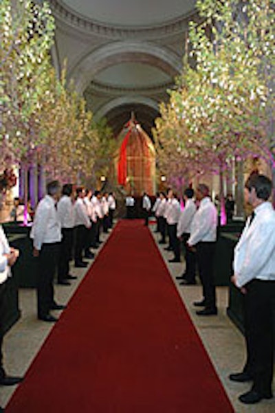 Raul Avila and Jean-Hugues de Chatillon took inspiration from Paul Poiret's colorful, exotic designs, placing a giant gilded birdcage holding four live peacocks at the entrance to the event.