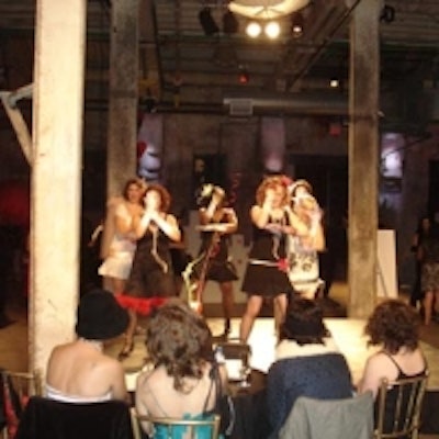 The Vaudeville Vamp Revue performed on stage before seated guests at the Buy Design for Windfall charity fund-raiser held at the Distillery Historic District.
