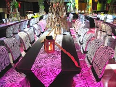 Eden Planning Inc. and Essential Event Rentals teamed up to create a lush, tropic atmosphere at the Guvernment/Kool Haus for the annual Tech Data gala fundraiser using faux Zebra print runners and chair covers with matching black spandex table covers. Exotic glow provided by Apex Sound & Lights.