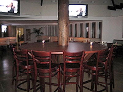 A communal table centers the downstairs dining room.