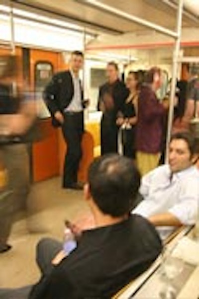 TTC Commissioner Adam Giambrone (left, background) mingled with guests in one of four orange-upholstered subway cars parked at the disused Lower Bay subway station for Film Italia, ANICA and the Italian Trade Commission's annual TIFF party.