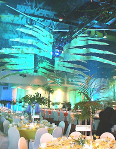 Event planners created a tropical Florida theme with lighting and custom props.