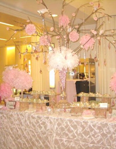 A centerpiece of pink feathers, flowers, and crystals kept the pink theme alive at the station created by A Joy Wallace Catering Production & Design Team.