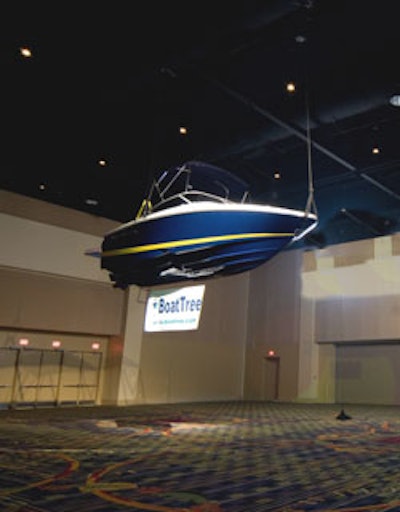A 19-foot Regal boat was suspended from the ballroom's ceiling to illustrate its immense size.