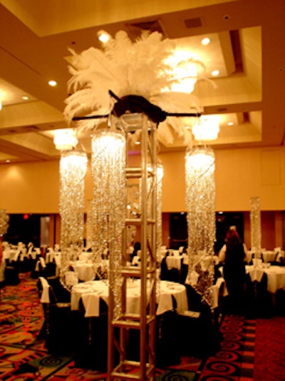 Event planners created a sleek and stylish ballroom with black and white linens from Panache accented by rhinestones, silver, and crystal centerpieces.