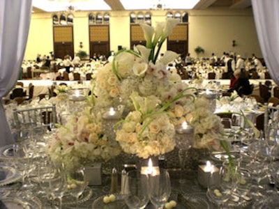 The Event Firm created a multilevel centerpiece with roses, hydrangeas, orchids, and calla lilies for the V.I.P. table.