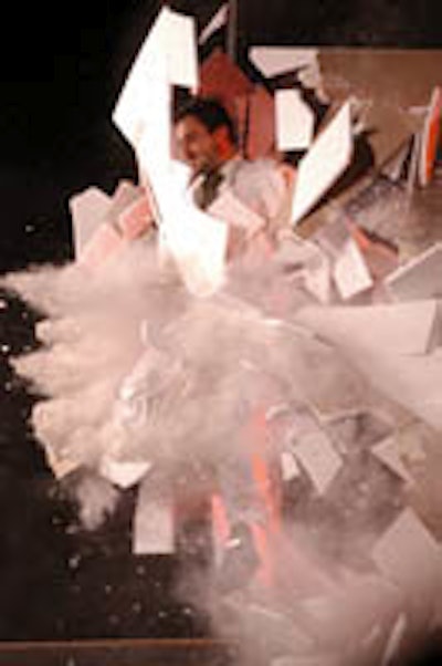 Performers charge through suspended fake walls in Fuerzabruta.