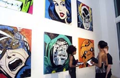 Guests admire Dave White's artwork at 'F.A.M.E. Collective '