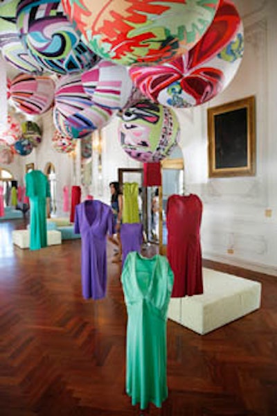 Artist Gerald Cholot hung garments from oversize balloons draped in Pucci fabric in an art installation to honor the late designer.
