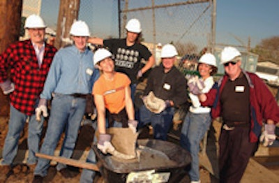 Coworkers tackle a Habitat for Humanity site.