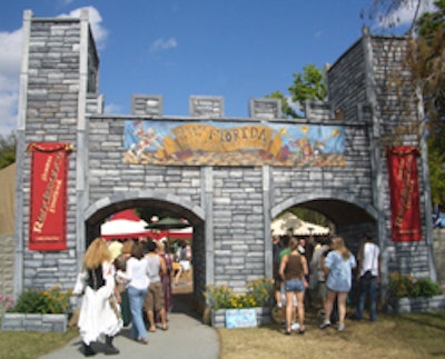 Guests enter the festival through a castle archway.