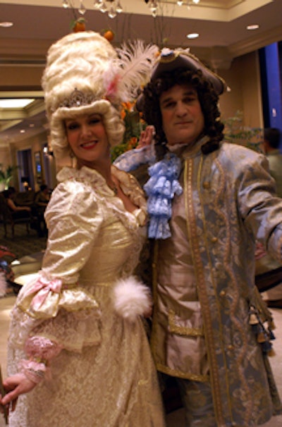 Models in 18th-century costumes reminiscent of the days of Marie Antoinette greeted guests.