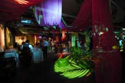 Colorful lighting and silk swags at the benefit's entryway