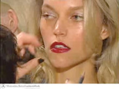 A model getting primped in one of IMG's behind-the-scenes Fashion Week videos.