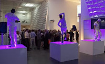 Dancers posed on pedestals in the museum's main room.