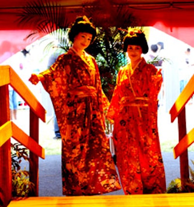 Two geishas greeted guests as they entered the tent.