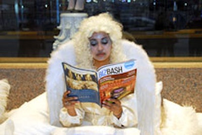 A reclining angel with feathered wings read a copy of BizBash Chicago as guests arrived at the venue.