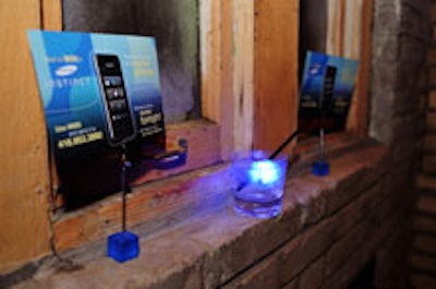 Glowing cubes and promotional cards at the Samsung Instinct launch.