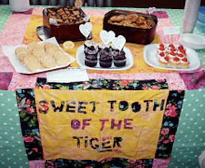 A bake sale table from Sweet Tooth of the Tiger.