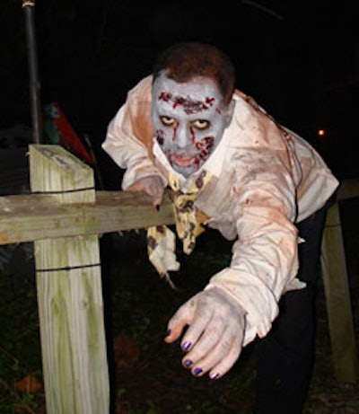 Zombies wandered throughout the haunted graveyard and amongst partygoers.