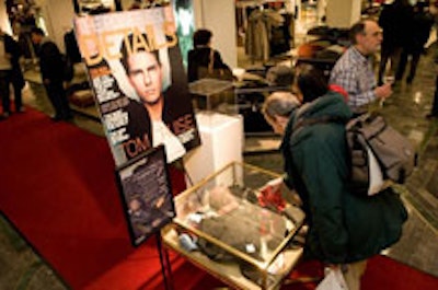 At Guys Night Out, the latest cover of Details and a goodie bag display case