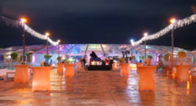 The cocktail hour, originally set to take place outside the tent, was moved inside at the last minute due to uncertain weather conditions.