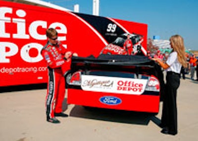 Driver Carl Edwards and the 2008 winner reveal the Office Depot car.