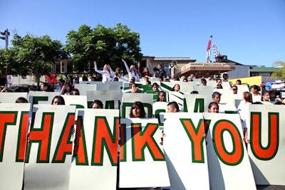 A card stunt at the Farmers Market's 75th anniversary