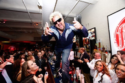 Guy Fieri, up to his usual theatrical antics, at the New York City Wine & Food Festival