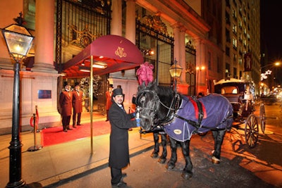 Two horses pull an antique buggy outside the after-party.