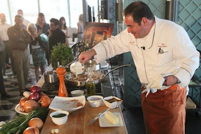 Emeril Lagasse conducting a cooking demonstration