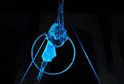 An aerialist dressed as Alice