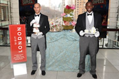 Models dressed as butlers, tea services in hand