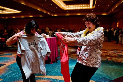 Attendees participating in the party's T-shirt swap
