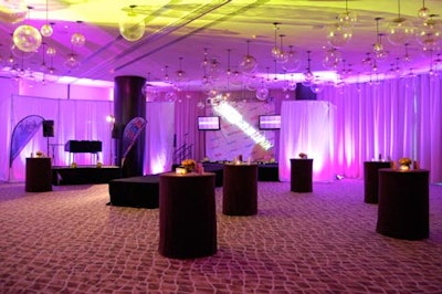 Purple and yellow lighting illuminated the ballroom