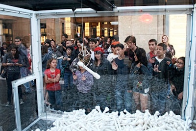 The crowd with the Bones crane game on Hollywood Boulevard