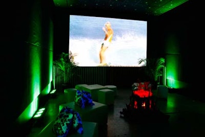 Surf movies played on projectors. This room featured a 'Night Beach Bonfire ' installation by artist Jen Stark.