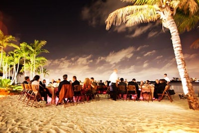 The intimate dinner was held on the beach overlooking the bay.