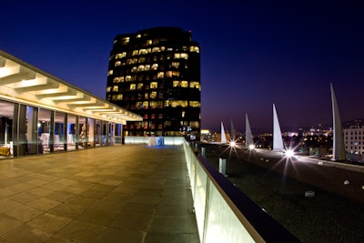 The terrace around the Petersen Penthouse features dramatic lighting.