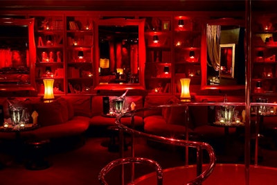 The interior seats 650 and surrounds a sunken dance floor, stained in dark ebony.