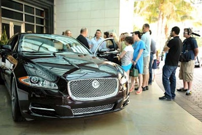 Guests listened to an informational briefing at the start of the 2011 Jaguar XJ driving experience at ONE Bal Harbour Resort & Spa.