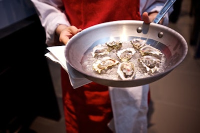 Servers passed hors d 'oeuvres in All-Clad Cookware.