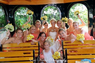 Excited wedding party onboard trolley at Palm Beach reception