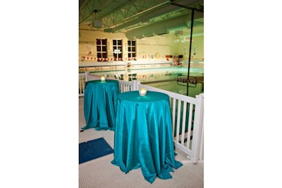 Highboy tables surrounded the pool, where synchronized swimming was part of the evening's entertainment.