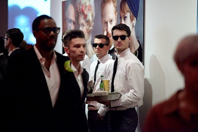 Waiters in sunglasses passed Peroni.