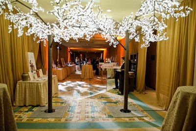 Trees covered in lights created an archway entrance to the Young Professionals Council reception.