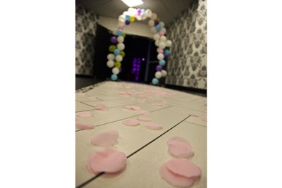 Organizers scattered pink silk rose petals on the floor leading to the ballroom.