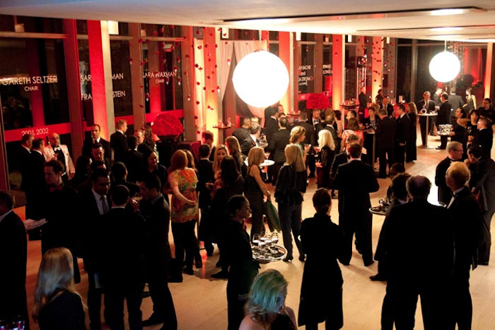 After The Show, guests mingled in the reception space. A timeline of Canfar Chairs lined the windows.