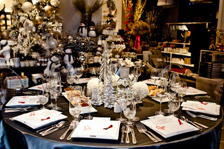 Crystal and silver Christmas trees were used as one of three different centrepieces at Teatro Verde, an eclectic home and garden store. Guests dined among the products on the first floor.